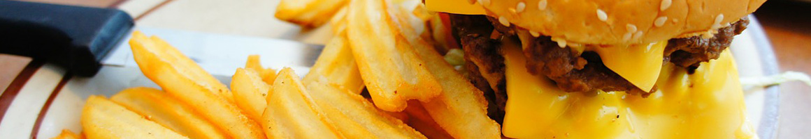 Eating Burger at Tay's Burger Shack restaurant in North Kansas City, MO.